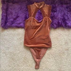 women’s orange body suit